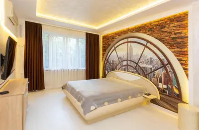 a bedroom with a bed in front of a window at Central Vitosha Apartment in Sofia