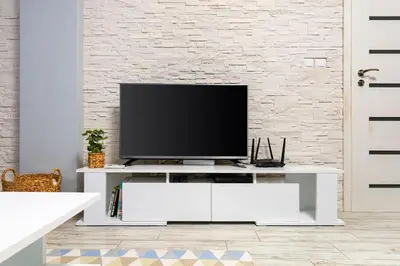 a living room with a tv on a white entertainment center at Super Center flat Parchevich in Plovdiv