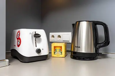 a coffee maker and a toaster sitting on a counter at Super Center flat Parchevich in Plovdiv