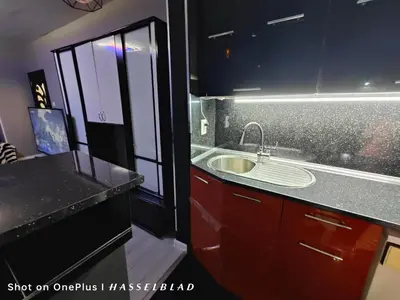 a bathroom with a sink and a counter top at Тристаен апартамент в центъра in Sofia