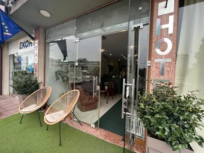 a couple of chairs sitting outside of a store at Family Hotel 007 Ivan Dimitrov-Kuklata 15 Str in Sofia