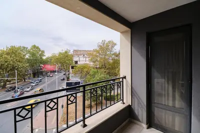 a balcony with a view of a city street at Cozy 1-bed Apartment in Plovdiv