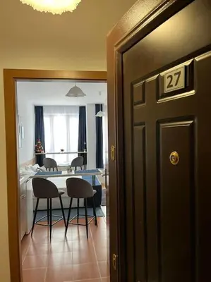 a dining room with a table and chairs in a room at Apartment for rest in Borovets in Borovets
