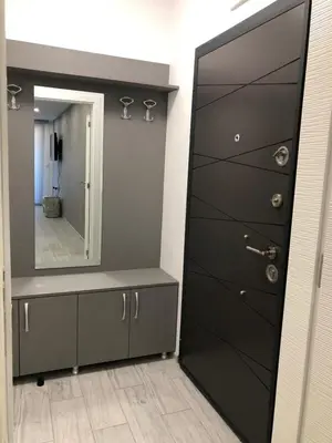 a bathroom with a mirror and a dresser and a door at Ultra Lux Studio Free Underground Secure Parking in Pazardzhik