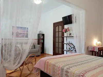 a bedroom with a bed and a couch at Sofia Center Chic Suite - Separate Kitchen and Balcony in Sofia