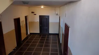 an empty hallway with a door and a tiled floor at Sofia Center Chic Suite - Separate Kitchen and Balcony in Sofia