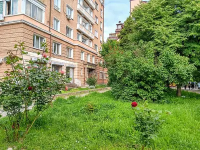 a field of grass in front of a building at Sofia Center Chic Suite - Separate Kitchen and Balcony in Sofia