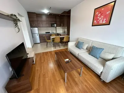 a living room with a couch and a table at Nice apartment in Belvedere Club in Bansko