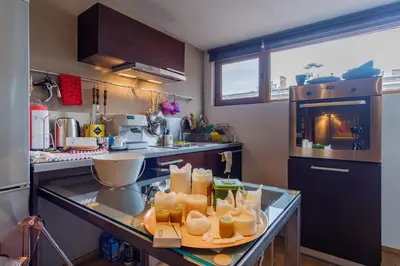 a kitchen with a counter with food on it at The Gallery - Art Studio in the Heart of Sofia by Flat Mаnager in Sofia