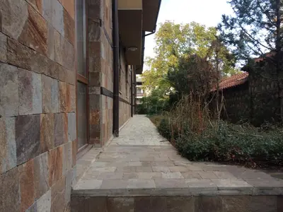 a brick alleyway next to a building at Banderitsa Apartment 1 in Bansko