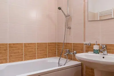 a bathroom with a bath tub and a sink at Mountain Apartment in Borovets Ski Resort in Borovets