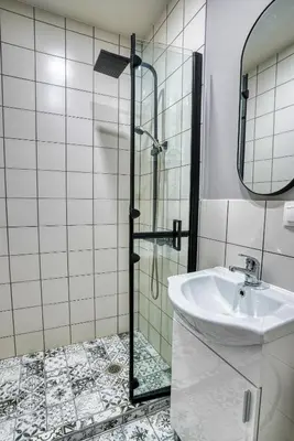 a bathroom with a shower and a sink at Lily's Studio 2 by Bulgarentals - Central Sofia in Sofia