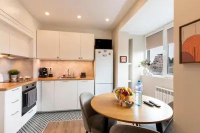 a kitchen with a table with a bowl of fruit on it at Your Place in Sofia