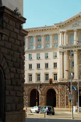 a large building with cars parked in front of it at Lily's Studio 5 by Bulgarentals - Central Sofia in Sofia