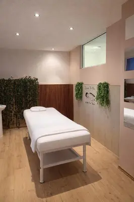 a hospital room with a white bed in it at Хотел Костенец in Kostenets Village