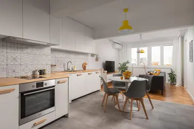 a kitchen and dining room with a table and chairs at Bright and Stylish 2BD Flat in The City Centre by Flat Mаnager in Sofia
