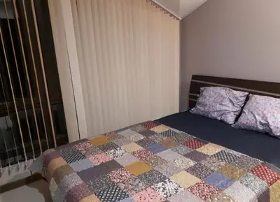 a bedroom with a bed with a quilt on it at Apartament by Zenit in Terra Complex B30 in Razlog