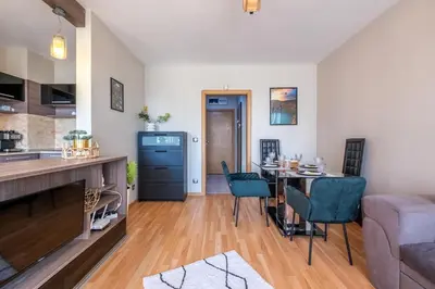 a kitchen and living room with a table and chairs at Deja vu, Cozy & Quiet 1 BDR Apt Fast Wi-Fi in Sofia