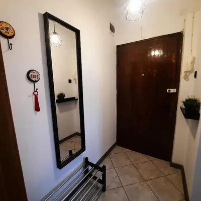 a mirror on a wall next to a door at Lucky number 7 Studio in Sofia