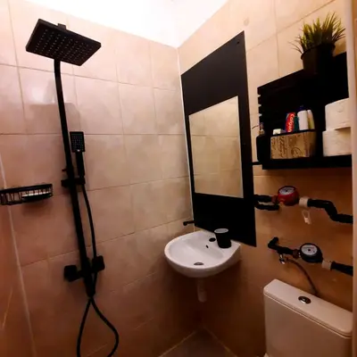 a bathroom with a sink and a mirror at Lucky number 7 Studio in Sofia