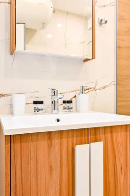 a bathroom with a sink and a mirror at Armand de Azurro in Sofia