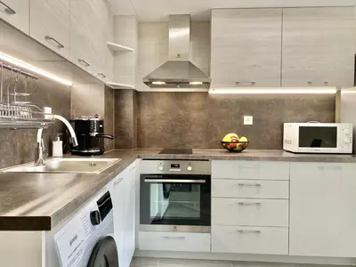 a kitchen with white cabinets and a sink at Beautiful & Comfy Apartment for 4 Guest and Free Parking in Plovdiv