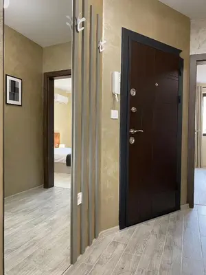 a hallway with a black door and a bedroom at Beautiful & Comfy Apartment for 4 Guest and Free Parking in Plovdiv