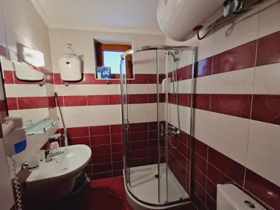 a bathroom with a shower and a sink at апартаменти Уют Гранд Манастира in Pamporovo