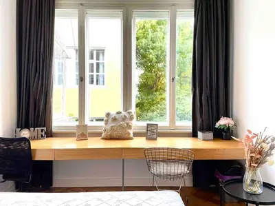 a desk in front of a window in a room at Heart of the city in Sofia