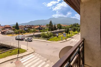 a view from a balcony of a city street at One bedroom apartment in Hotel Banderitsa ,Bansko in Bansko