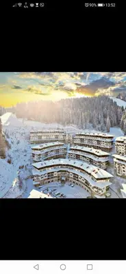 an aerial view of a building in the snow at Snow Mountain Grand Monastery in Pamporovo