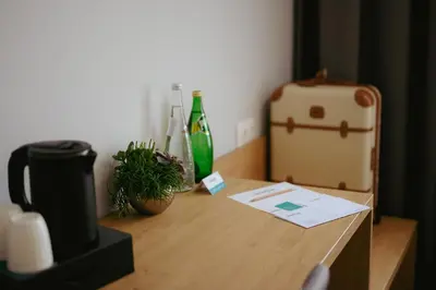 a wooden desk with a suitcase and plants on it at LOCATION in Sofia