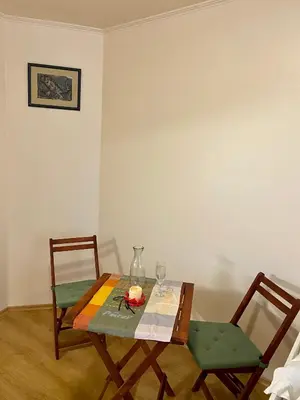 a table with two chairs and a table with at Sofia Cozy Retreat in Sofia