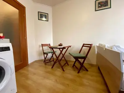 a kitchen with a table and chairs in a room at Sofia Cozy Retreat in Sofia