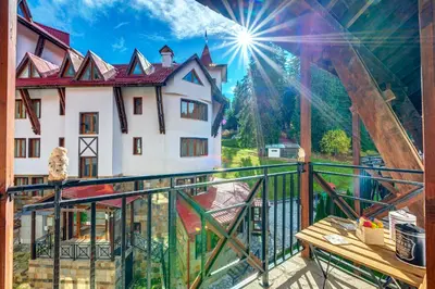 a view of a house from a balcony at 1BD Ski View Retreat in Pamporovo with Fireplace by Flat Mаnager in Pamporovo