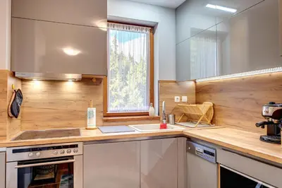 a kitchen with a sink and a counter top at Luxury Flat in Grand Resort Pamporovo by Flat Mаnager in Pamporovo