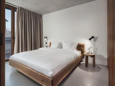 a bedroom with a large bed and a window at DOT Sofia in Sofia