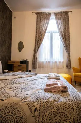 a bedroom with a bed and a window at Apartment Serdika 1 in Sofia