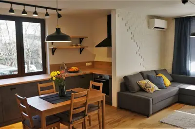 a kitchen and living room with a table and a couch at 