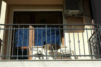 a balcony with a chair in front of a door at 
