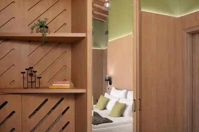 a room with a bed and a book shelf at Luxury Villa with Hot Pool in Banya