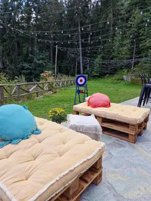 two large beds sitting on top of a patio at Къща за гости Донука in Panichishte