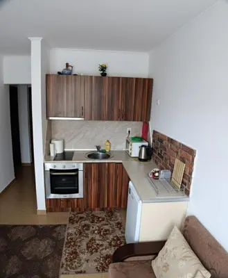 a small kitchen with a sink and a stove at Flat Cedar Lodge 2min walk to gondola in Bansko