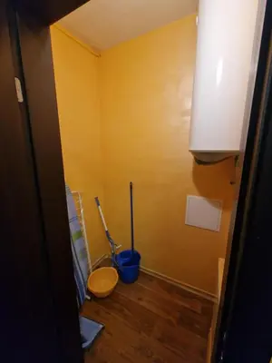 a bathroom with a toilet and a plunger in it at Bansko Royal Towers George Apartment, next to the Gongola in Bansko