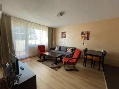 a living room with a couch and chairs and a table at Bansko Royal Towers Thea Apartment, modern renovated bathroom in Bansko