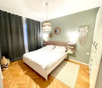 a bedroom with a white bed in a room at Dreamy Apartment Near To The Center in Sofia