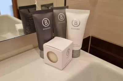 a bathroom counter with someented products on it at BH & Semiramida Ski Apartment in Borovets