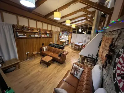 a large living room with couches and a table at Villa - VALL DI VALL in Pirin Golf & Country Club in Razlog