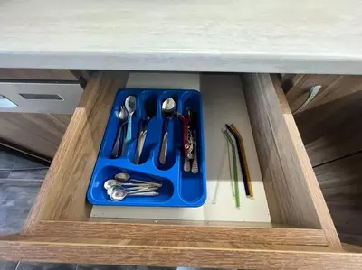 a drawer with a blue tray of tools in a cabinet at Lucky7Lux1 in Pazardzhik