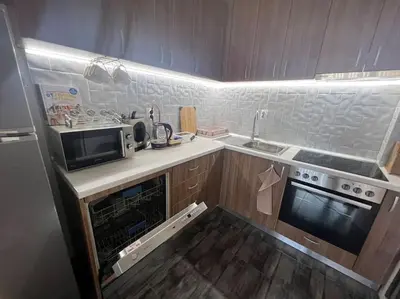 a small kitchen with a microwave and a stove at Lucky7Lux1 in Pazardzhik